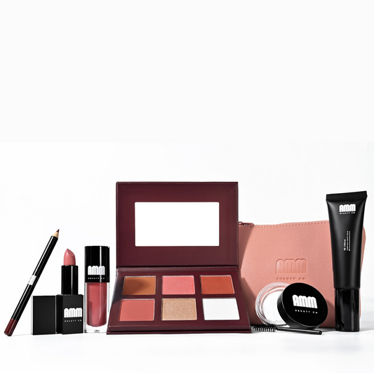 AMM Beauty Co face lip and brow products styled in a flat lay